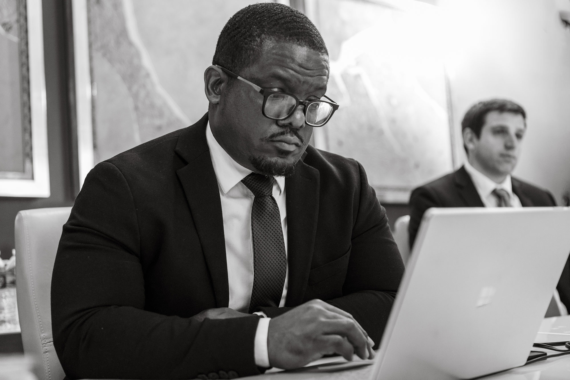 Lawyer photographed working in office environment for law firm editorial photography